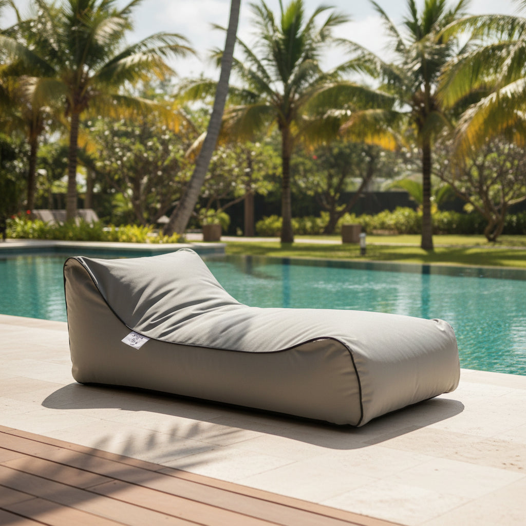 Grey Bean bag next to swimming pool of Villa