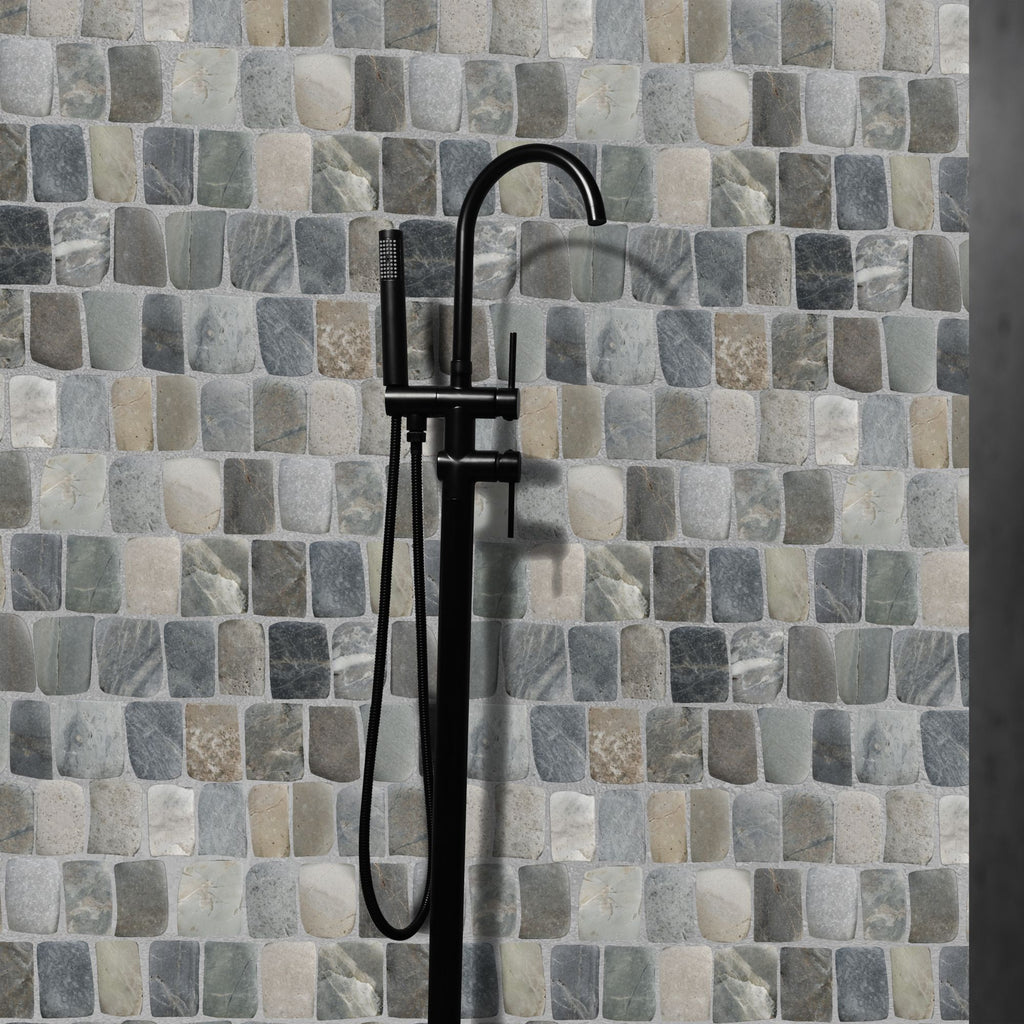 Black shower faucet against a mosaic tile wall with various shades of gray and beige.