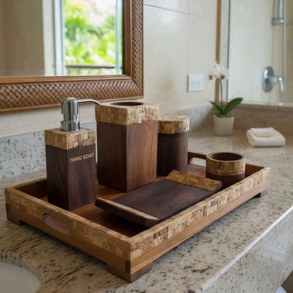 A bathroom vanity set made of dark wood and coconutshell, including a hand soap dispenser, a soap dish, a jar, a cup, and a tray, arranged on a granite countertop.