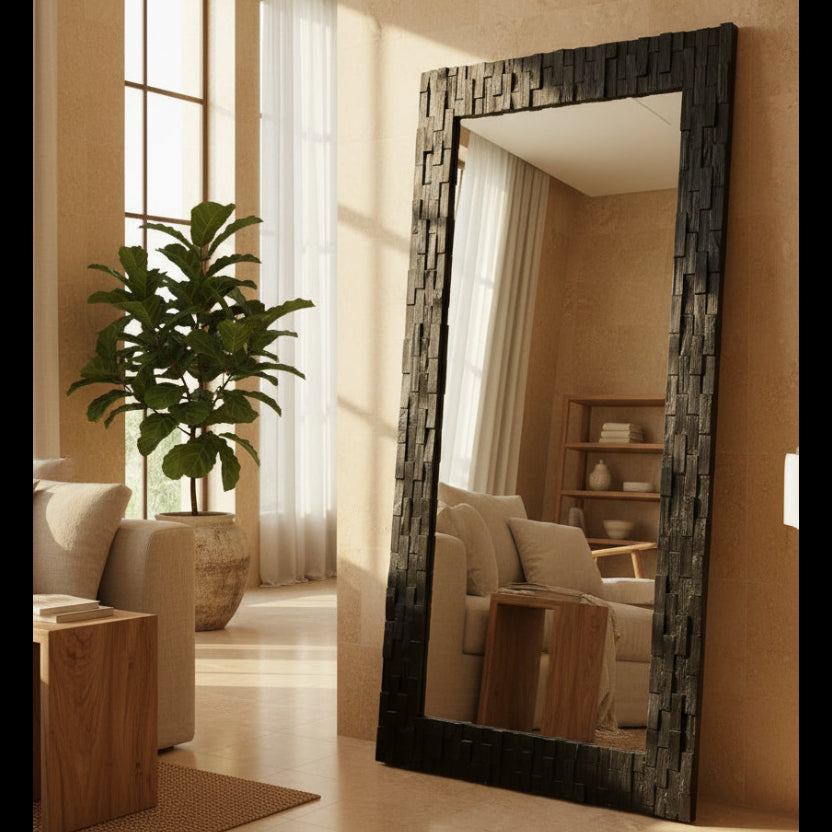 Large decorative mirror with a textured frame in a living room setting.