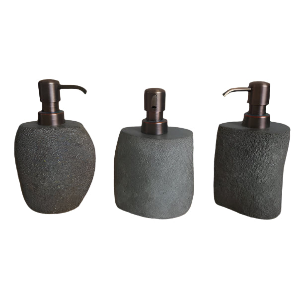 Three stone-textured soap dispensers with bronze pumps.
