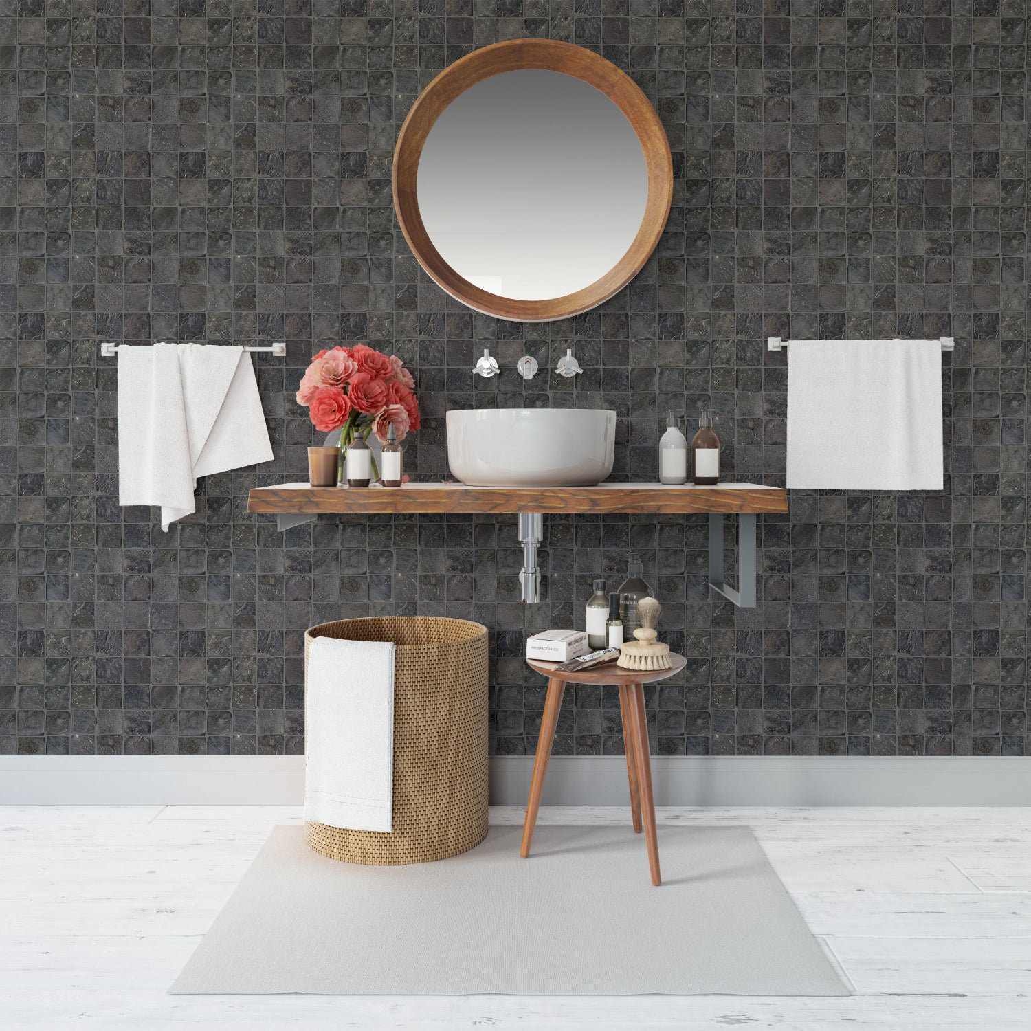 Bathroom with dark tiled wall, wooden vanity, round mirror, and various bathroom items.
