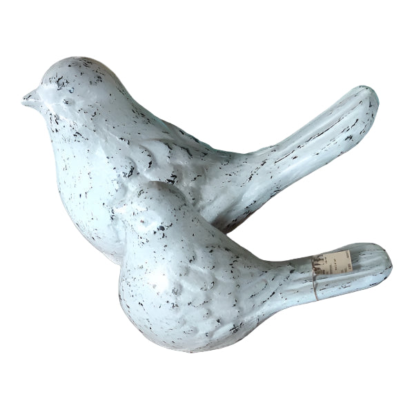 A pair of decorative homing pigeons, one larger than the other, with a grayish-white color and textured surface.