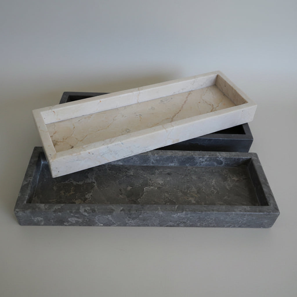Two stone trays, one beige and one gray, made for hospitality supply