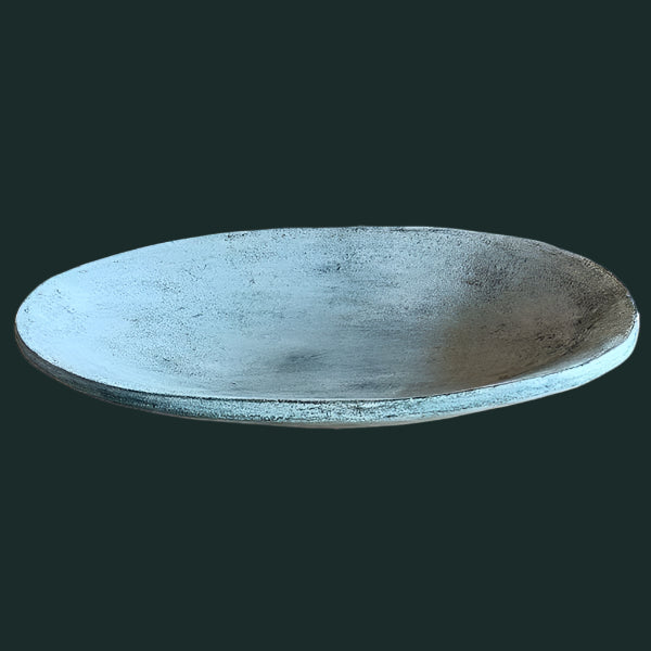 A gray oval terracotta decorative plate on a plain background.