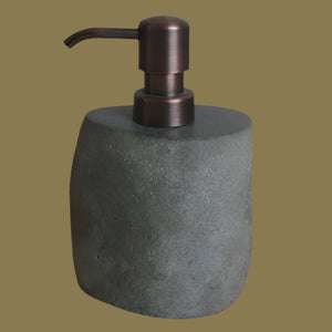 Stone Soap dispenser with bronze pump.