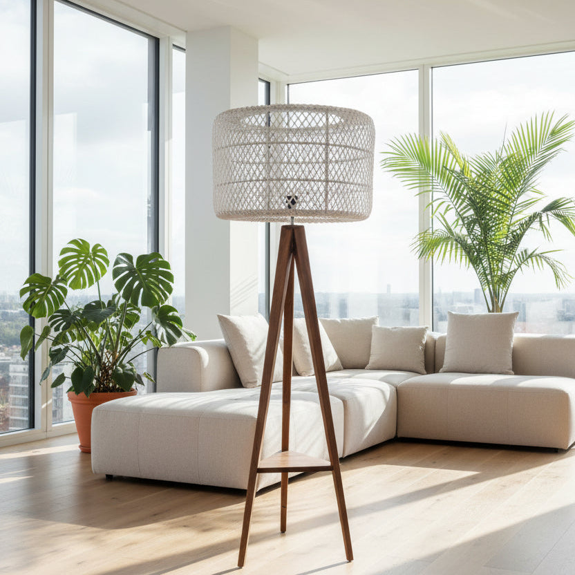 A floor lamp with a triangular teak wood base and a woven wicker shade.